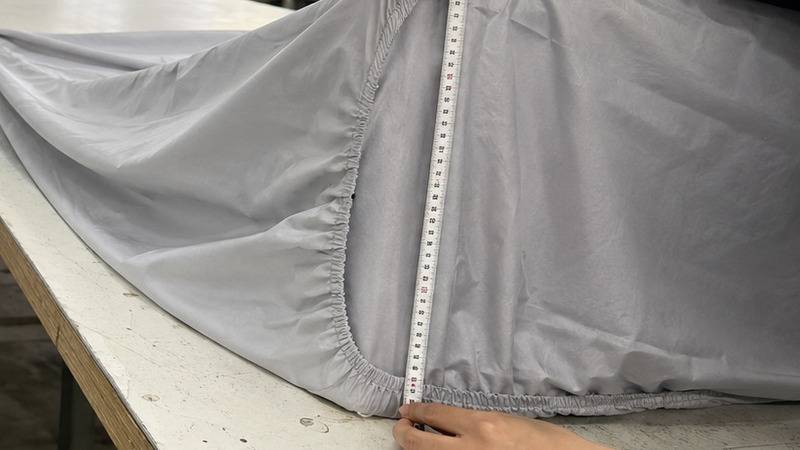 Measuring finished fitted sheet pocket depth